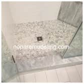 Basement Bathroom Tile Shower enclosure with frameless door.
Porcelain floor tile.