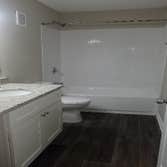 Photos by Combined Construction Services, Inc #1 Interior multi-family renovation including cabinets, countertops, flooring, paint, trim, and appliance