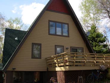 refreshed house Working with owner we did a complete redo of exterior with new windows and doors and cement siding and shakes