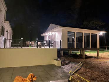 Photos by Jesse Fletcher Construction #4 24x40 deck. Half of the deck is a screened in room. Uplighting on the ceiling beams, recessed lighting and one