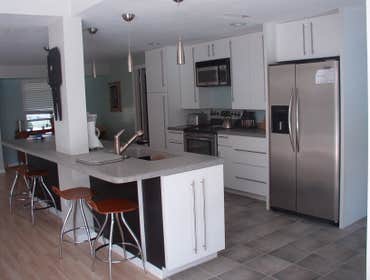 Complete Remodel Services included new flooring throughout the house, inside doors, closets, and kitchen and bathroom remodeling.