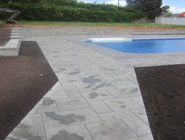 Photos by Dunn Landscape Construction #1 After initial pool installation provide all hardscape including retaining walls, pool deck, walkways and plant
