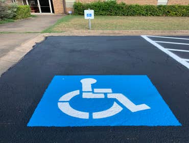 Seal coating + striping + handicap sing paint