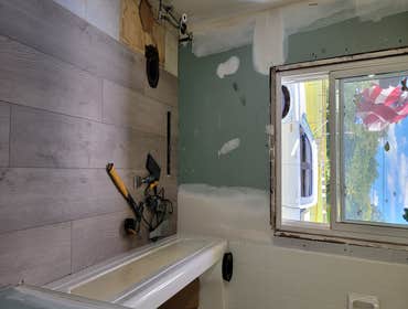 Flooring, vanity, mirror and toilet, plus finish work