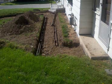 Photo(s) from Freelance Construction & Concrete Concrete Garage Floor and Sidewalk