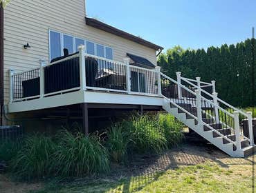 Photos by Pristine Construction #26 New deck along with roof over entry door