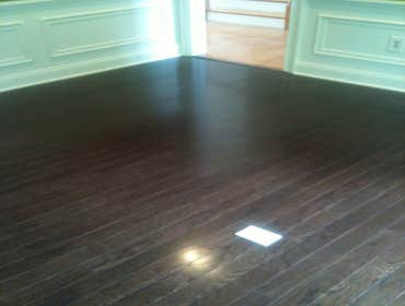 A family's living room and kitchen installed with laminate This project started out with us removing the old existing carpet in the living room and old