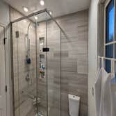 Photos by Spera LLC #1 Limestone bathroom remodel.