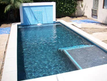Photo(s) from CUSTOM DERIAN POOLS Infinity Pools, Hillside Pools, Landscaping, BBQs, Outdoor Fireplaces, Shade structures, Pergolas, Landscaping, Mason