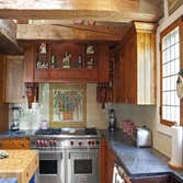 Tewksbury Horse Farm Kitchen This period style kitchen on a vintage horse farm was meticulously built utilizing a combination of tiger maple, cherry wo