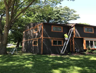 Photos by Herreras Painting LLC #1 Black solid stain
Natural cedar tone trim