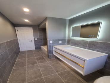 BATHROOMS Transform Your Bathroom Oasis: Experience the luxury and comfort you deserve with our expert bathroom renovation services.