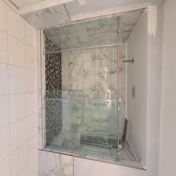 Shower with glass sliding door