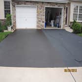 Project photos from Back To Black Sealcoating LLC The First picture is a driveway that was done 3 days prior to taking the picture.. The second picture