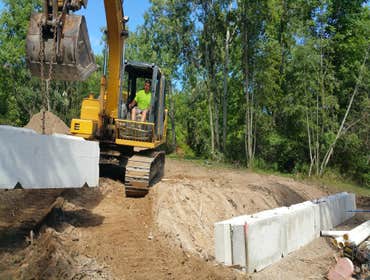 Photos from Fischer Brothers LLC Installing a concrete block retaining wall