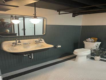 Speakeasy Basement Remodel We did a complete overhaul of this tired space adding a huge period perfect bathroom, copper bar tops with custom mirrored g