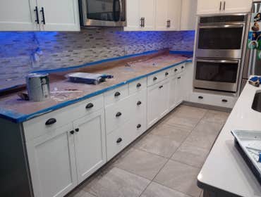 Kitchen cabinet refinish Cabinets went from black to these beautiful cupboards. This project took only a few days and the owner loves it!!