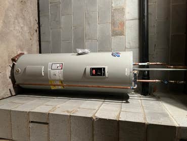 Photos by Stellitano Heating and Air Conditioning, Inc #18 Various projects. Bradford White water heater, Bryant Furnace. Mitsubishi Roof top Condenser