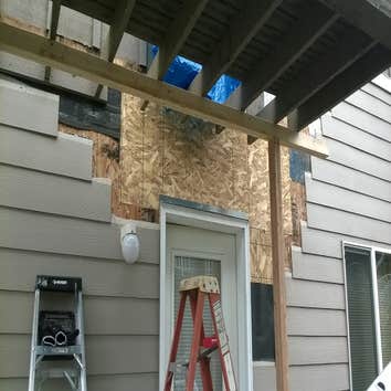 Exterior water damage repair Due to an improperly installed exterior door located on the deck above, severe rot had taken place on the apartment below.