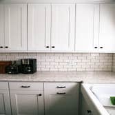 Clowdus Kitchen This client came to me with a vision for a custom kitchen that would make the space feel larger and maximize storage. We designed pull-