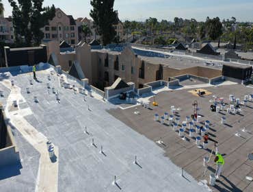Photos by Peak Builders & Roofers of Orange County #6 American Standard, triple ply system on a commercial building