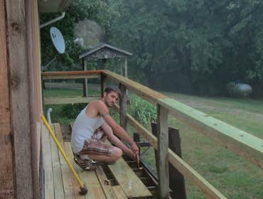 Project photos from Authentic Services Inc. Tearing off old decking boards, floor joist, and handrails. Replacing all of them and plus installing a ent