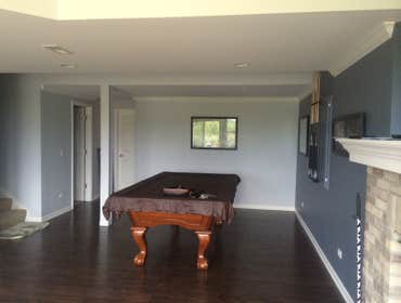 Photos by J and R Construction Service & More Inc #3 we designed and built a finished basement, with a kitchen, bath, fireplace and bedroom.