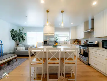 El Segundo Kitchen Remodel We transformed this El Segundo kitchen into your bright, open-concept haven! Picture white cabinets with brass handles, whit