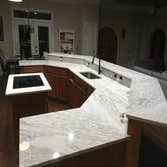 Brand Kitchen Renovation Carrara countertops & new backsplashes bring this once dated kitchen a sense of classic style and luxury for this professional