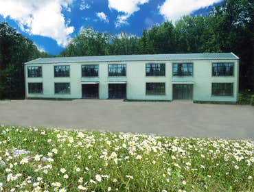 Rural Office Building An existing pre-fabricated steel building previously used as a milling facility for wood products was re-purposed to accommodate 