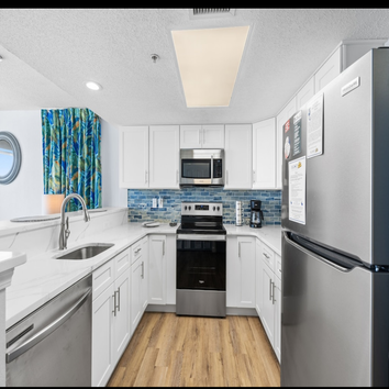 Photos by Castle Headquarters Inc #1 Oceanfront kitchen renovation, with glass tile