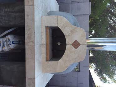 Pizza Oven Custom Pizza Oven with Trvertine prep area and wrap of opening with Rojo Alicante marble accent