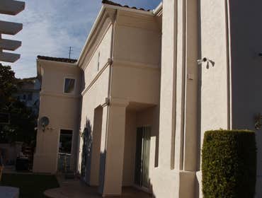 Chris Matthews Painting Project Exterior painting of two-story home and exterior wall fence, staining of deck, stairways and doors. San Diego, CA