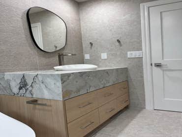 Bathroom & Laundry room remodeling This high-end bathroom and laundry room remodel in San Jose features custom-built cabinetry, designer tile work, mod