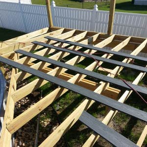 Photos by DJI Inc #1 Approximately 26'x20' deck around pool. Vinyl rails and composite decking