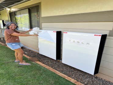 Peeling off the Tesla sticker! Another happy customer.