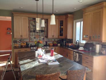 Kitchens Couple of the many. One with a large leathered granite island and the other a custom made island frame for Quartz.