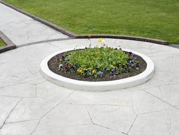 Photos by Stamped Concrete Denver LLC #1 Stamped concrete, often called textured or imprinted concrete, replicates the look of many different stones su