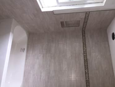Photos by J. Roberts Installations #3 Here's a shower we tiled. we also tiled half way up the walls all the way around