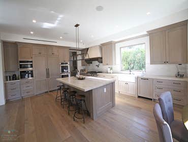 Los Angeles Stunning Kitchen Remodel we updated the kitchen, guest bathroom and wine cellar with a cool chic brown wood.