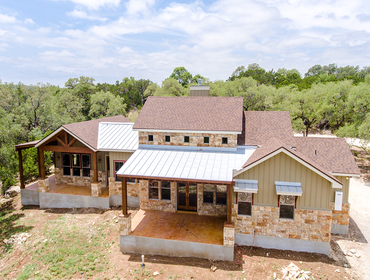 Stone and Stucco Hill Country Residence This single story home was designed to fit gently on the site in close proximity to a grove of trees. It is evo