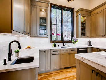 Kitchen remodel We remodeled this home’s closed-off kitchen into an open concept floor plan. In collaboration with the architect, we removed the wall b