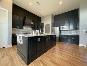 Photos by Austin Fine Finish Painting LLC #1 46 Piece Cabinet repaint. Benjamin Moore Satin Impervo color matched to SW Tricorn Black. Photos taken d