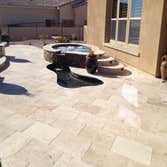 Reverse negative edge Travertine deck, spa, reverse negative edge play pool,