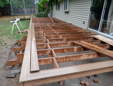 Photos by Andrades Handyman #1 Build new deck with trex this was a package 3 bathrooms 1. Reframe shower walls, Tile entire shower install glass doors,