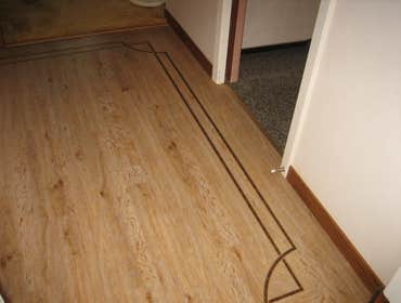Photo(s) from Beau Monde Fine Floors Inc Amtico's planks with borders