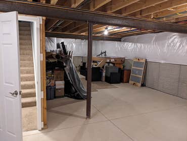 Cozy Basement Transformation Transformed a blank basement into a stylish, functional space designed for relaxation and connection.