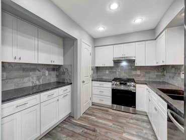 Kitchen Remodel We just completed a stunning kitchen remodel for a client! We removed the old peninsula and washer/dryer to open up the space, updated 