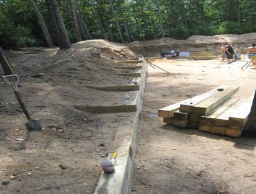 GRADING AND INSTALLATION OF RETAINING WALL SYSTEM