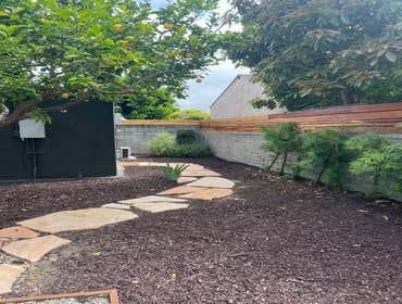 Wood fence install over blockwall.